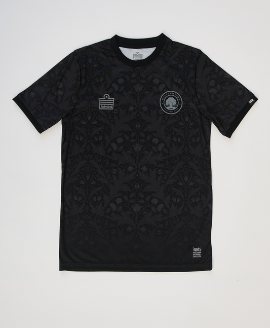 Front view of the Walthamstow FC Blackout jersey, showing the William Morris archive pattern sublimated black on black
