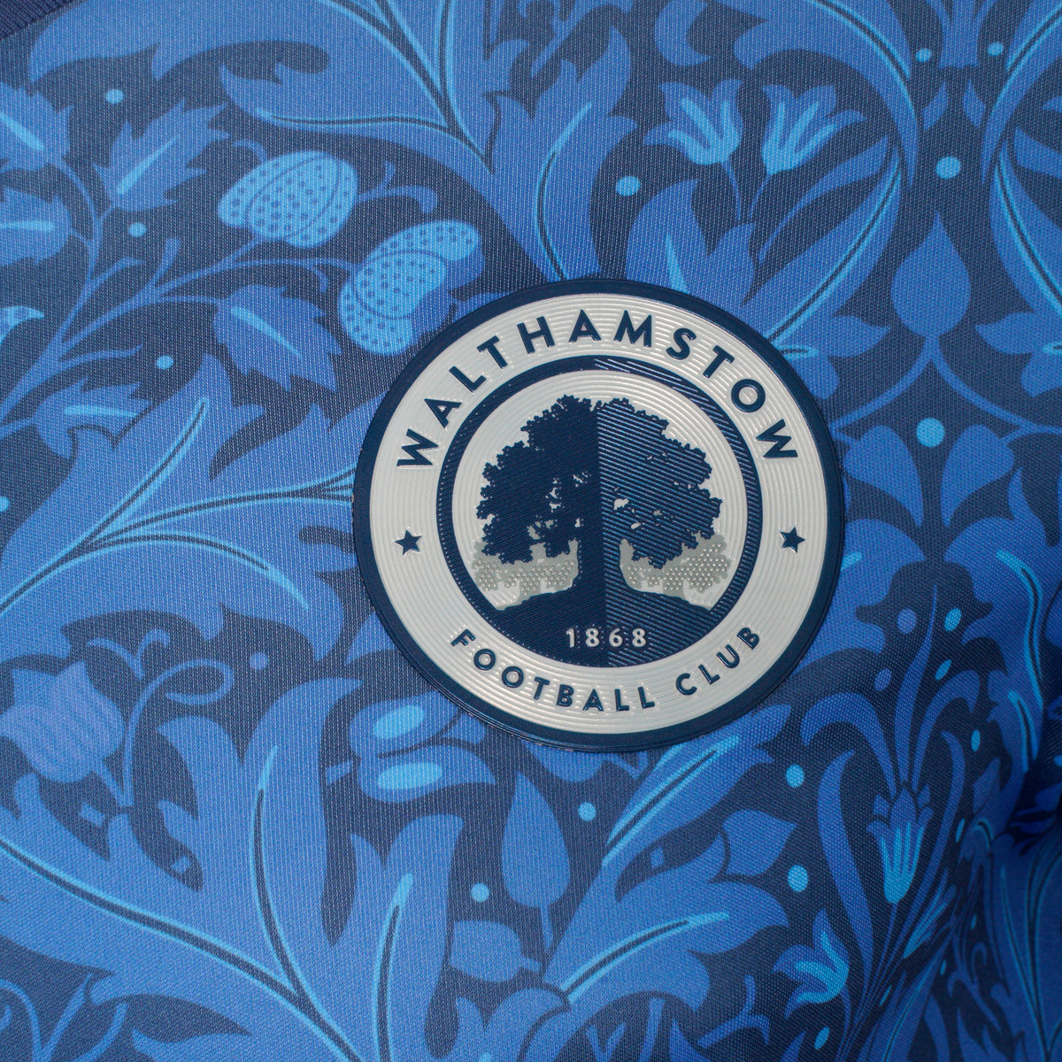 Close-up of the Walthamstow FC club crest on the home shirt