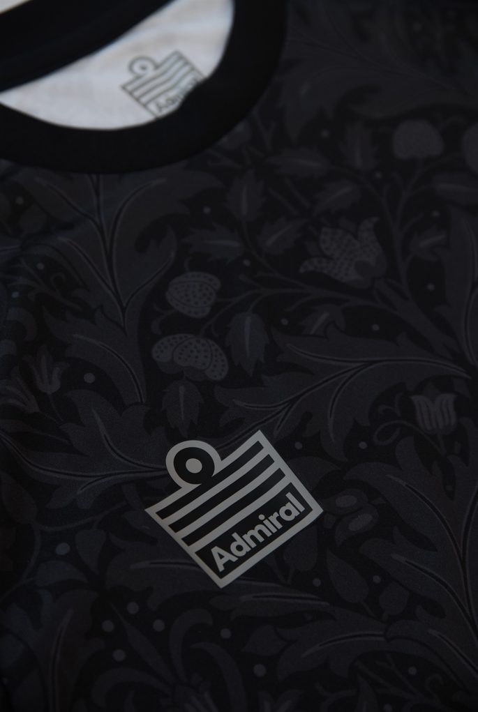 Close-up of the Admiral logo on the left breast of the Blackout jersey