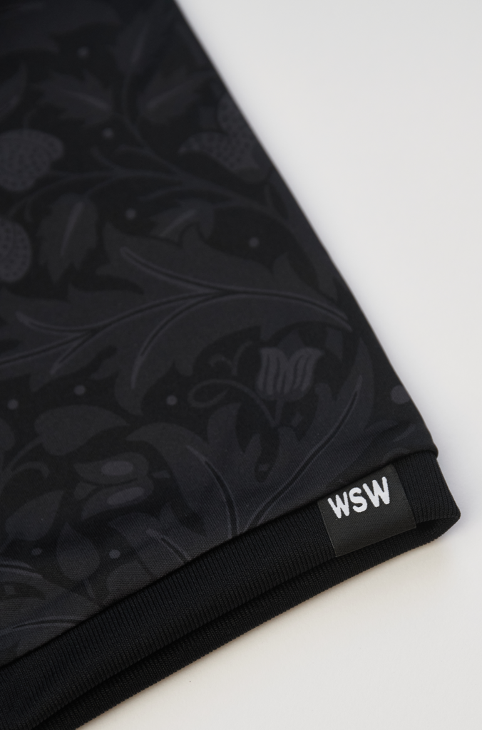 Close-up of the Wood Street Walls WSW logo on the sleeve of the Blackout jersey